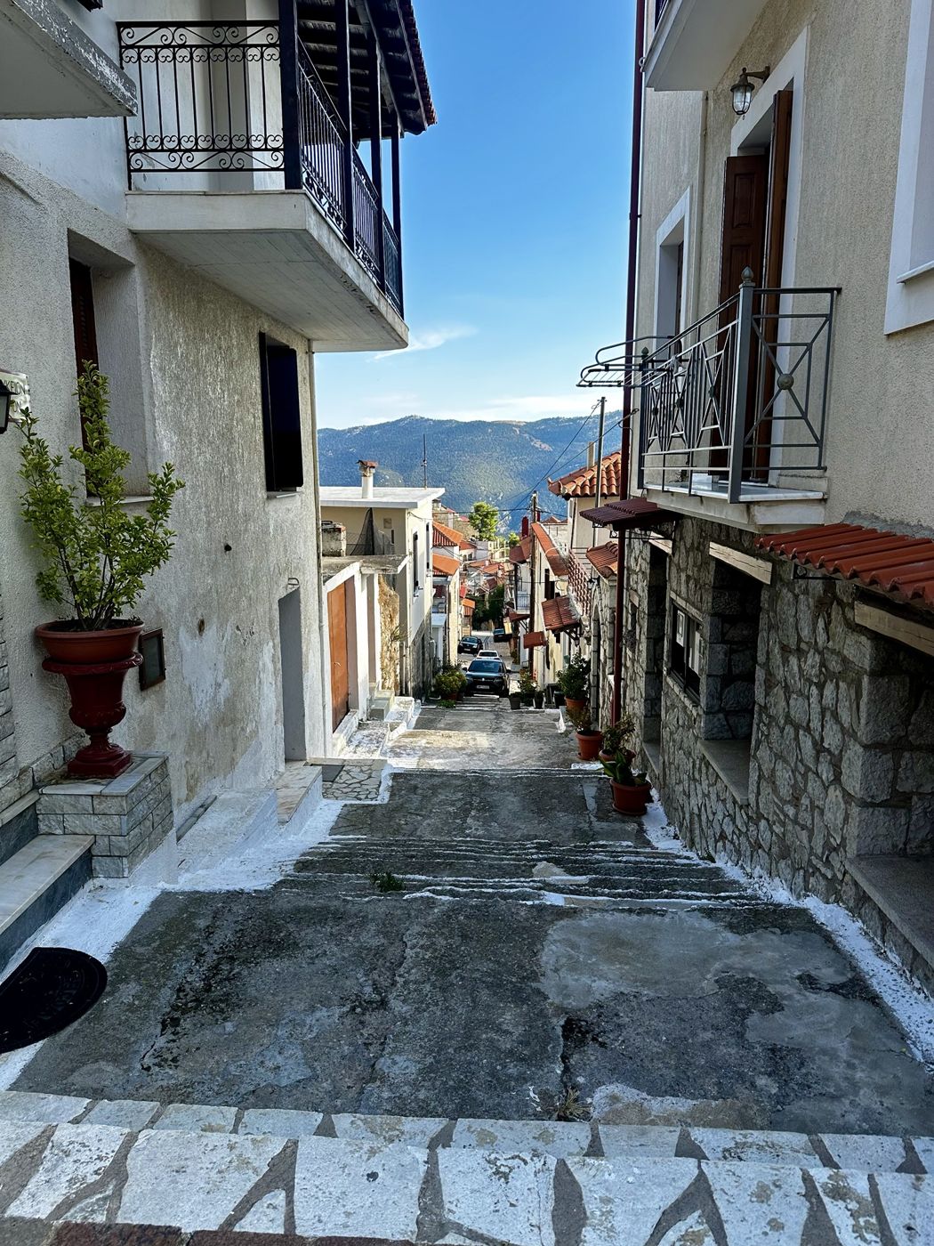A stepped street in Arachova leading down toward the mountains