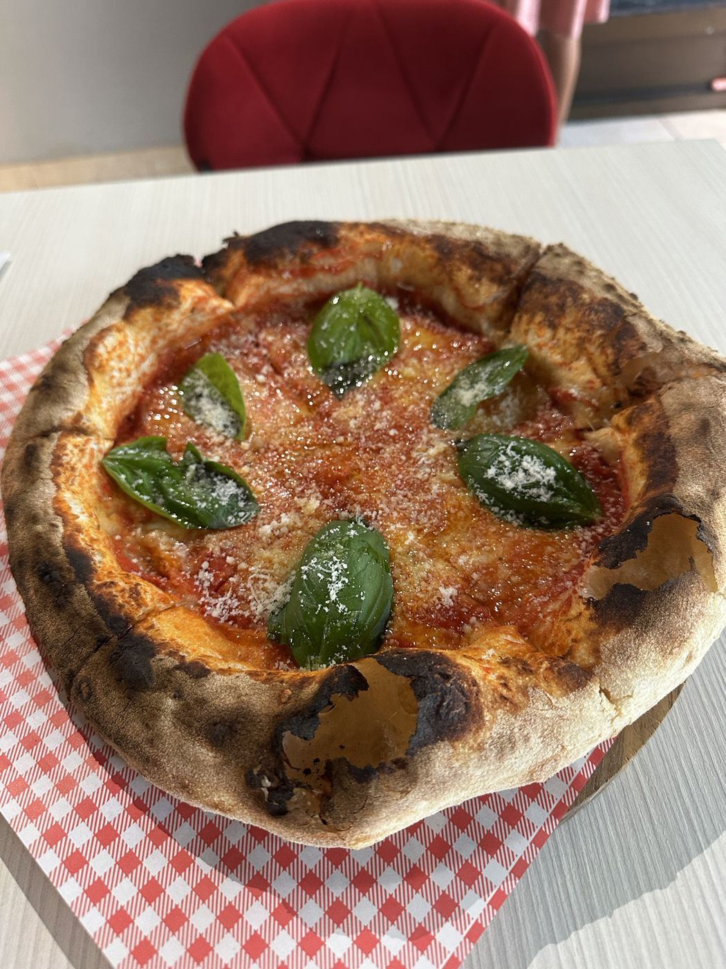 A wood-fired margherita pizza with basil at Nicky’s Pizzeria