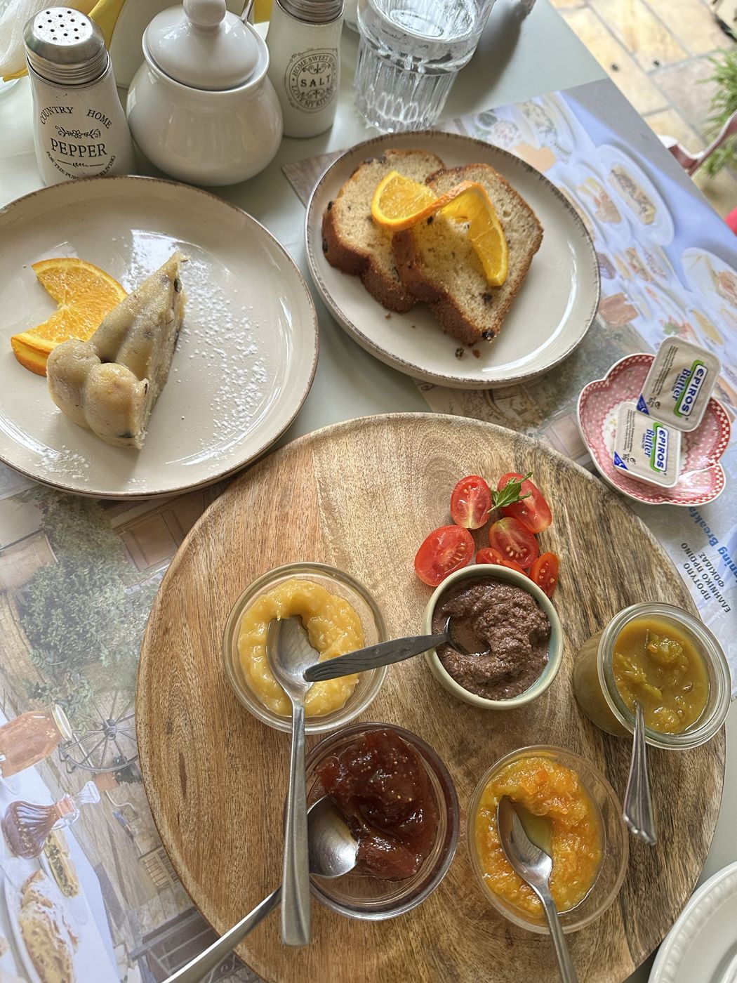 Breakfast at Ganimede Hotel with homemade spreads, cake and orange slices
