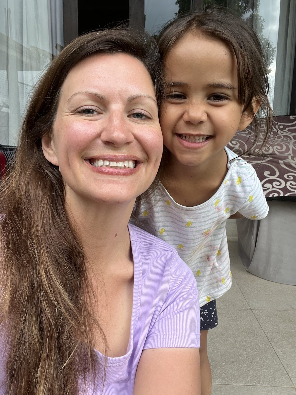 Brittany and her youngest daughter smiling at home